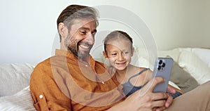Father and cute little 6s daughter enjoy new mobile application