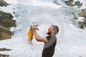 Father and daughter baby traveling together in mountains