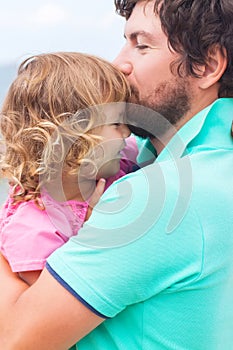 Father and daughter at the beach.