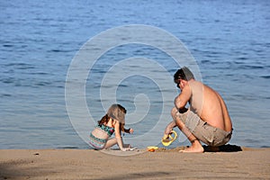 Father and daughter on the beach