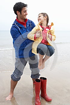 Father and daughter on beach