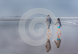 Father Daughter on Beach Low Tide Reflection in Fog