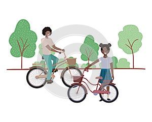 Father and daughter with bycicle in landscape