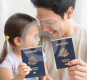 Father and daughter are celebrating receiving United States passports