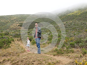 Father and daughter in country