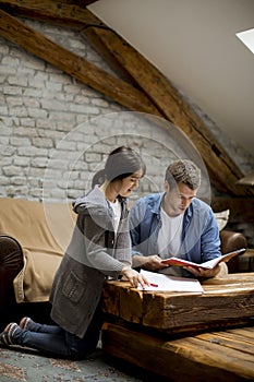 Father and  daughter doing homework at home