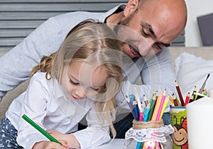 Father and daughter drawing together