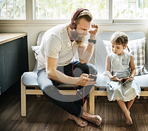 Father Daughter Entertainment Family Earphone Concept photo