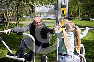 Father and daughter exercising outdoors