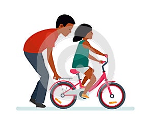 Father and daughter. Father helping daughter to ride a bike. White background. African American people.