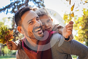 Father and daughter have fun together outside.