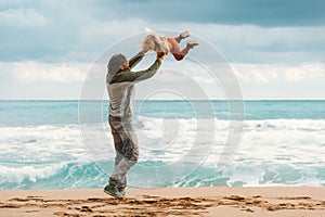 Father and daughter having fun family vacations lifestyle dad and child playing together outdoor walking on the beach