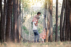 Father and daughter having fun and playing in the park