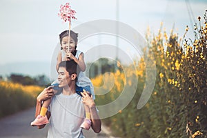 Father and daughter having fun to play together