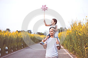 Father and daughter having fun to play together