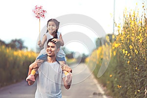 Father and daughter having fun to play together