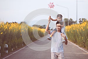 Father and daughter having fun to play together