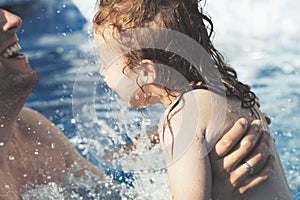 Father and daughter having fun together in a family swimming pool - Summer Family Vacation Fun Concept - Fatherhood moments of hap