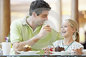 Father And Daughter Having Lunch Together