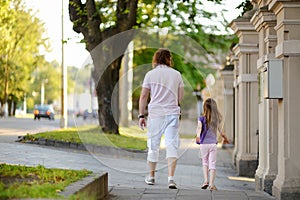 Father and daughter having a walk