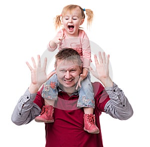Father with daughter on his shoulders with hands up