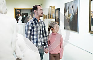 Father and daughter looking at expositions