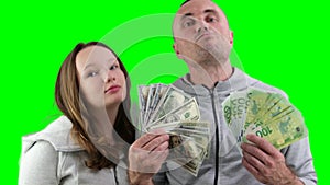 father and daughter a lot of money in their hands joy success dollars euro 100 dollar bill wave money like a fan look