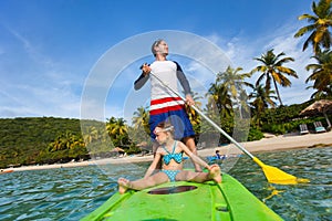 Father and daughter paddling