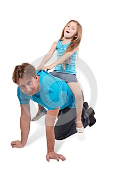 Father and daughter play horse-ride