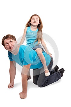 Father and daughter play horse-ride