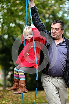 Father and daughter playing in the park