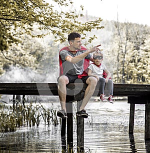 Father and daughter playing a super hero