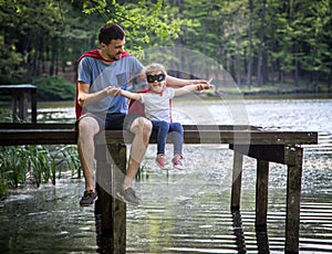 Father and daughter playing a super hero