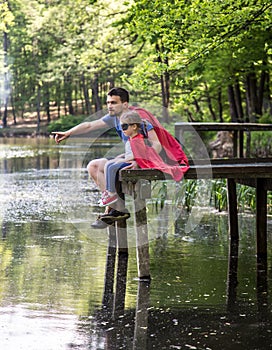 Father and daughter playing a super hero