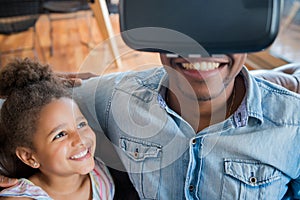 Father and daughter playing video games. photo