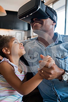 Father and daughter playing video games. photo