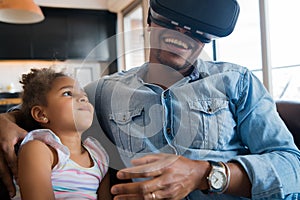 Father and daughter playing video games. photo