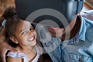 Father and daughter playing video games. photo