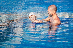 Father and daughter in the pool