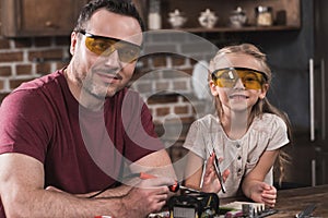 Father and daughter posing while brazing