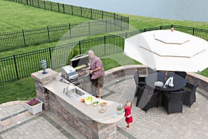 Father and daughter preparing a barbecue