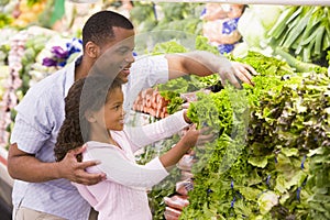 Father and daughter in produce section