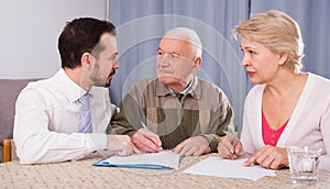 Father and daughter signing contract