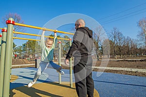 father and daughter spend active leisure time on the sports ground