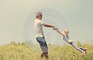 Father and daughter spinnig