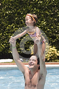 Father and daughter in Swimming pool