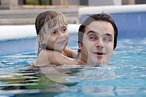 Father and daughter in Swimming pool