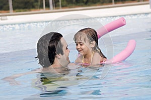 Father and daughter in Swimming pool