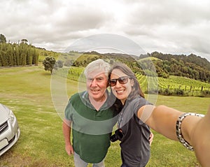 Father and daughter taking selfie - family tourists travelling t