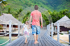 Father and daughter at tropical resort